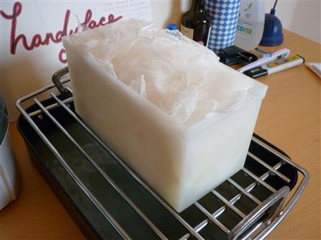 Curd in cheesecloth-lined mould